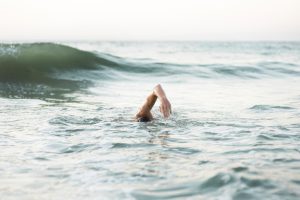 male swimmer swimming ocean